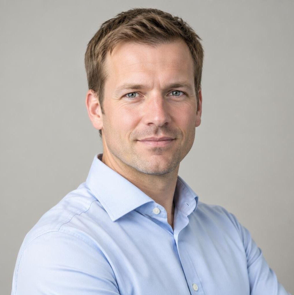 Portrait of a man in a shirt looking at the camera